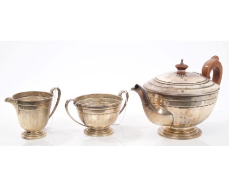 1930s three piece silver tea set - comprising teapot of half-fluted form, with stepped border, angular fruitwood handle and h