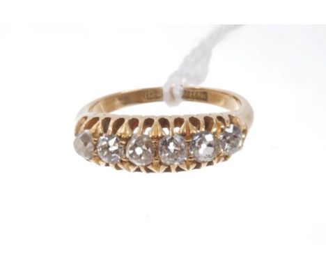 Victorian diamond six stone ring with six old cut diamonds in gold claw setting, on plain shank.  Estimated total diamond wei