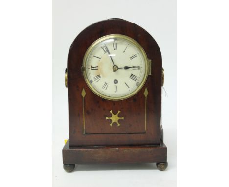 19th century mantel clock with spring-driven timepiece movement, white enamel dial with Roman numerals, in a domed mahogany c