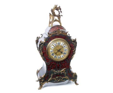 19th century mantel clock in the Louis XV style, with eight day movement striking on a gong, ornate gilt metal face with indi