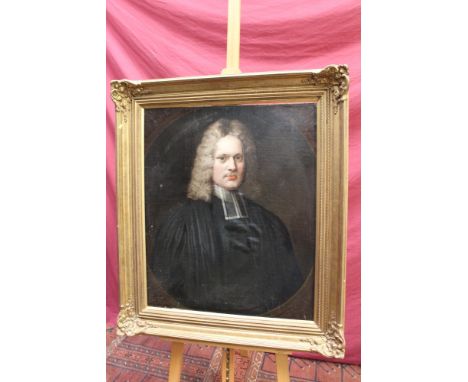 Early 18th century English School oil on canvas - portrait of a clergyman, within an oval, in gilt frame, 75cm x 62cm