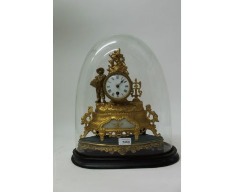 Late 19th century mantel clock with French eight day timepiece movement and white enamel dial with Roman numerals in a gilt m