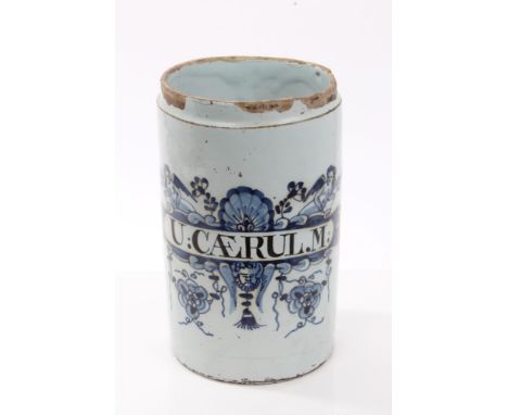 Early 18th century English London Delft blue and white drug jar of cylindrical form, with human mask, floral, shell and angel