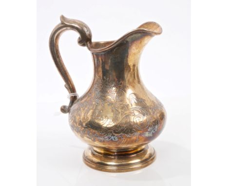 Victorian silver cream jug of baluster form, with chased floral decoration, engraved armorial and scroll handle, on circular 