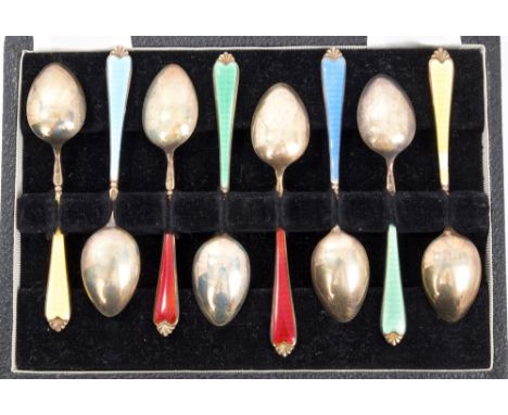 Set of eight silver gilt and guilloche enamel coffee spoons in a fitted case (Birmingham 1958), Adie Bros