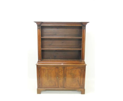 Regency mahogany two height open bookcase with beaded and moulded architectural frieze, two open shelves flanked by turned co