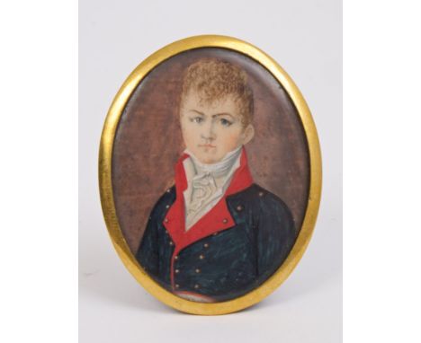 English School (circa 1820), watercolour on ivory - portrait of a young officer in military attire with high stock, oval, 5cm