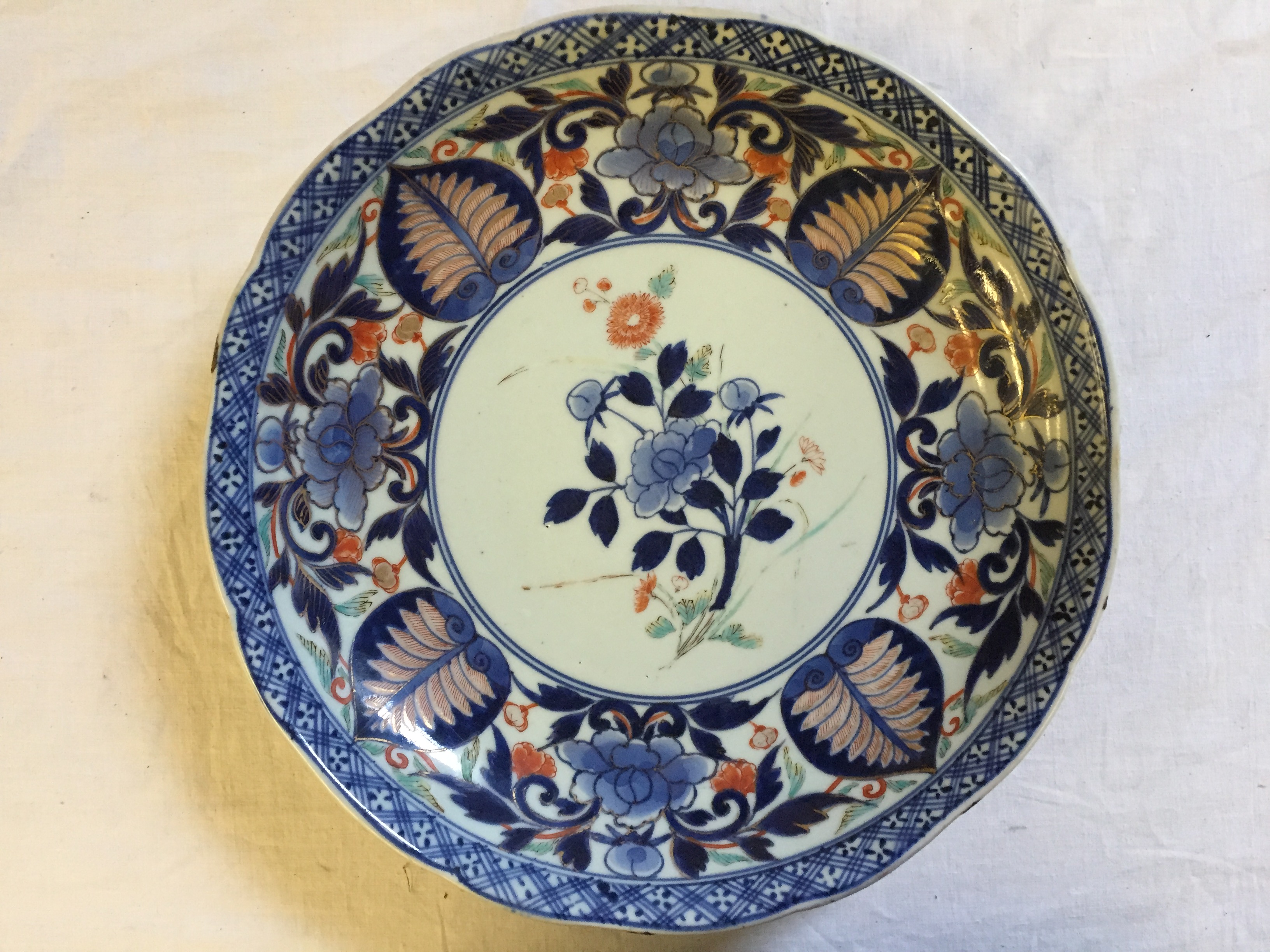 A Chinese plate with markings. 285 mm