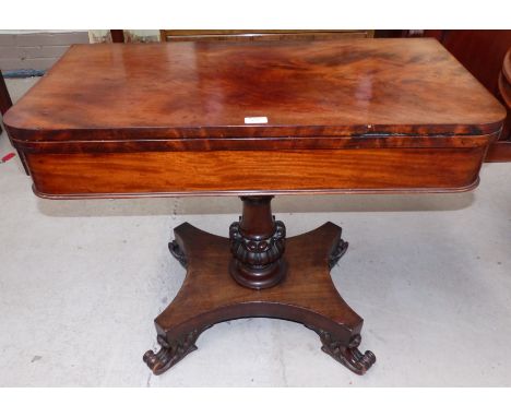 A William IV mahogany 'D' end fold over card table on turned and carved column, quatrefoil base and scroll feet, width 36"