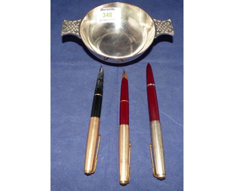 A small silver 2-handled bowl with Celtic decoration, inscribed, Edinburgh 1973, 5 oz.; 3 vintage Parker fountain pens