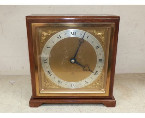 A mantel clock by Elliott, walnut case