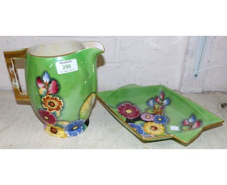 A Carltonware Art Deco green lustre jug decorated with flowers, height 8"; a similar dish, length 12" (jug handle gilt worn)