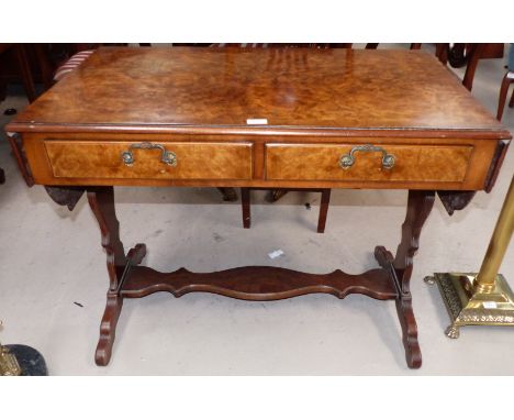 A Georgian style crossbanded walnut sofa table, Reprodux by Bevan & Funnell, on shaped ends and splay feet 