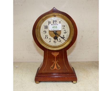 An Art Nouveau balloon top mantel clock in inlaid mahogany case