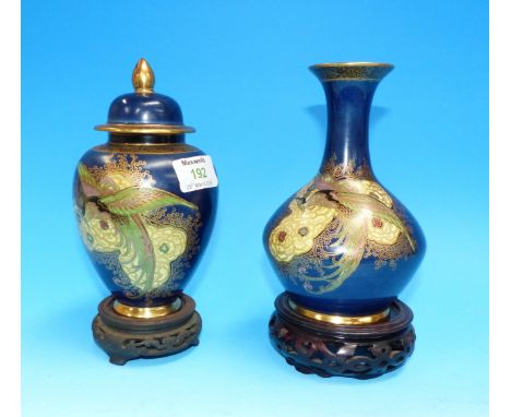 A 1930's Carltonware blue ground lustre covered vase with decoration of exotic birds; etc., height 8 "; a similar vase, heigh