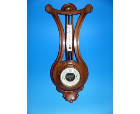 An Art Nouveau cased aneroid barometer and thermometer