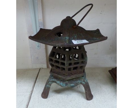 A cast iron oriental lantern