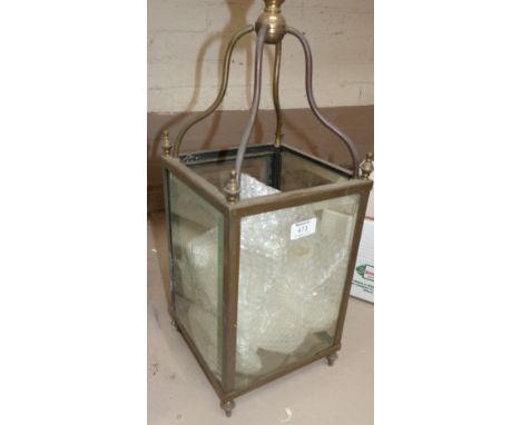 An Edwardian square brass hall lantern with sunburst glass panels