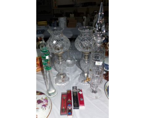 A pair of cut glass oil lamp style table lamps; a cut glass port fountain; a Galileo liquid filled thermometer; 5 spoons