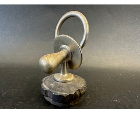 A car mascot in the form of a baby's dummy/soother, designed for an Austin 7, radiator cap mounted, approx. 3 1/4" tall overa