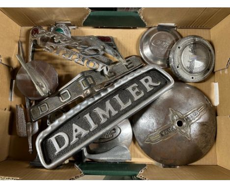 A box of car insignia, mascots and badges including Dennis, Dodge, Jowett Javelin etc.