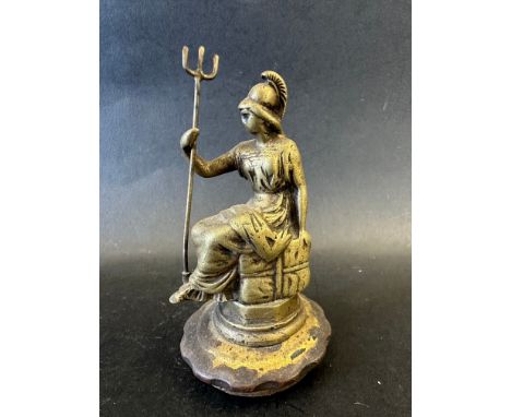 A car mascot in the form of Britannia sat on a  package bearing the cross of St. Christopher, unusually with original trident