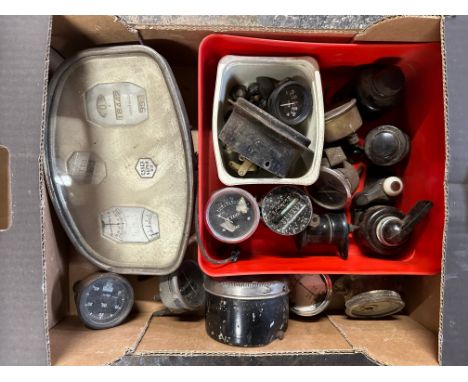 A box of gauges and switches including a Lucas dash lamp, bakelite light switches, an Essex dash panel etc.