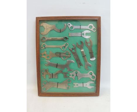 A framed and glazed dioramah display of bicycle tools.