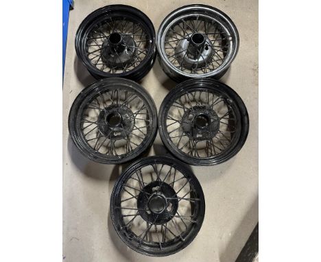 Five 16" Austin 7 wire wheels, some with wide rims for racing, refurbished and powder coated.