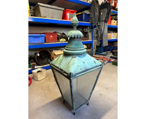 A Victorian design verdigris copper square lantern of tapering form with finial.