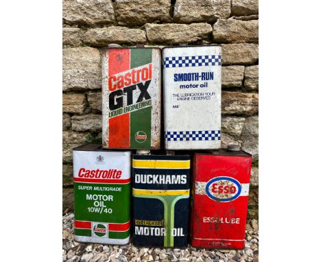 Five one gallon oil cans including Castrol GTX, Duckhams and Esso.