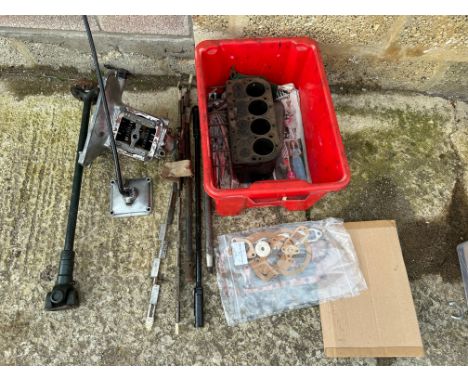 A selection of Austin 7 parts including engine block, propshaft, gearbox etc.