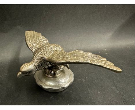 A Desmo eagle on ball car accessory mascot mounted on a radiator cap, approx. 2 3/4" high. 