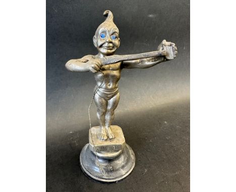 An Edwardian car mascot stamped Dinkie Doo depicting a winged character with blue glass eyes originally carring a bow and arr