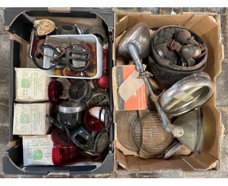 Two boxes of lamp parts including headlamp shells, headlamp glasses, D lamp shells, lenses etc.