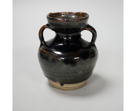 A Chinese Jian type two handled jar, possibly Song dynasty, 8cm high Provenance - the vendor lived in Hong Kong in the 1990s 