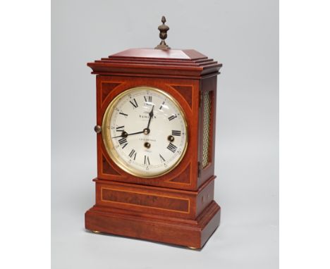 Sewills, Liverpool. An inlaid mantel clock with three train balance escapement movement, chiming on eight gongs, 37cm high
