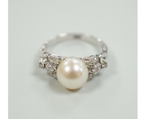 A 14k white metal and single stone cultured pearl set dress ring, with diamond cluster set shoulders, size J, gross weight 3.