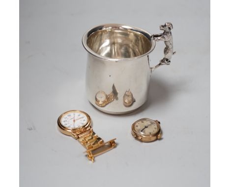 A George V silver christening mug, with dog handle, Sanders &amp; Mackenzie, Birmingham, 1931,  77mm, together with a lady's 