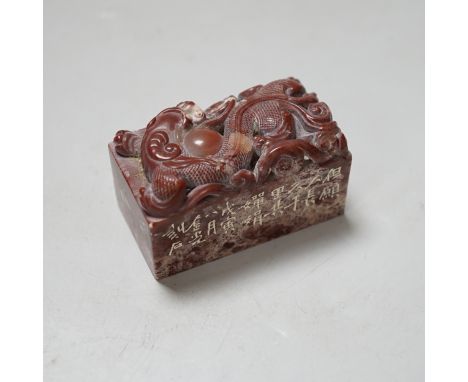 A Chinese chicken’s blood inscribed soapstone seal, carved with a dragon, 6cm Provenance - the vendor lived in Hong Kong in t