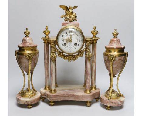 An early 20th century French gilt-metal and marble clock garniture, 38cm high