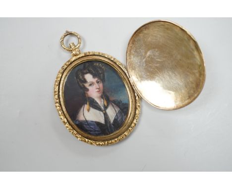 A Victorian engine turned yellow metal overlaid oval pendant locket, housing a miniature on ivory depicting a lady, overall 7