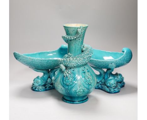 A pair of Burmantofts ‘dolphin’ pedestal bowls and a similar ‘dragon’ vase, 30cm