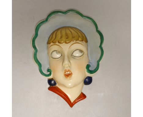 A Czechoslovakian Art Deco face mask, 22cm