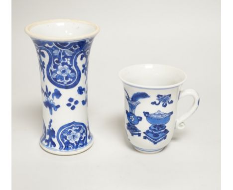 A Chinese blue and white small vase and a similar ‘Hundred Antiques’ chocolate cup, both Kangxi period, chocolate cup 9cms hi
