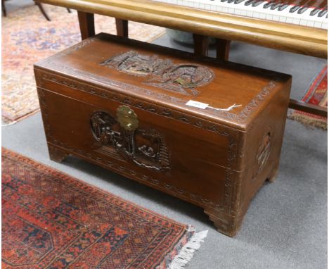 A Chinese carved camphor wood trunk, width 93cm, depth 44cm, height 48cm