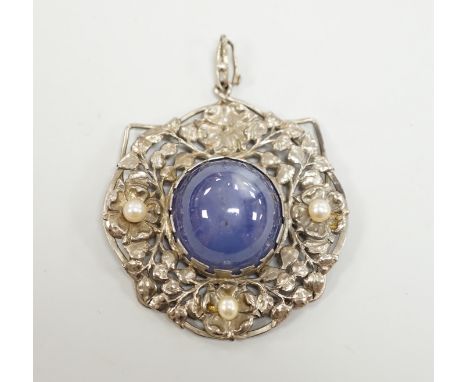 An early 20th century continental pierced white metal, cabochon star sapphire and cultured pearl set circular pendant, diamet