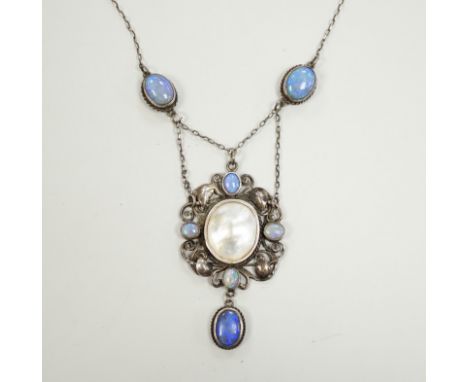 An Arts &amp; Crafts white metal, mother of pearl and gem set drop pendant necklace, in the manner of Sybil Dunlop, overall 5