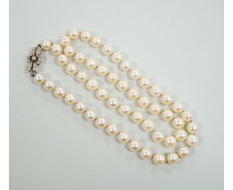 A single strand cultured pearl necklace, with diamond set white metal clasp, 48cm.