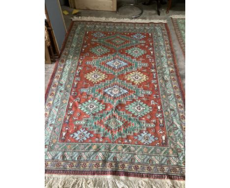 A Caucasian red ground carpet, 242 x 160cm